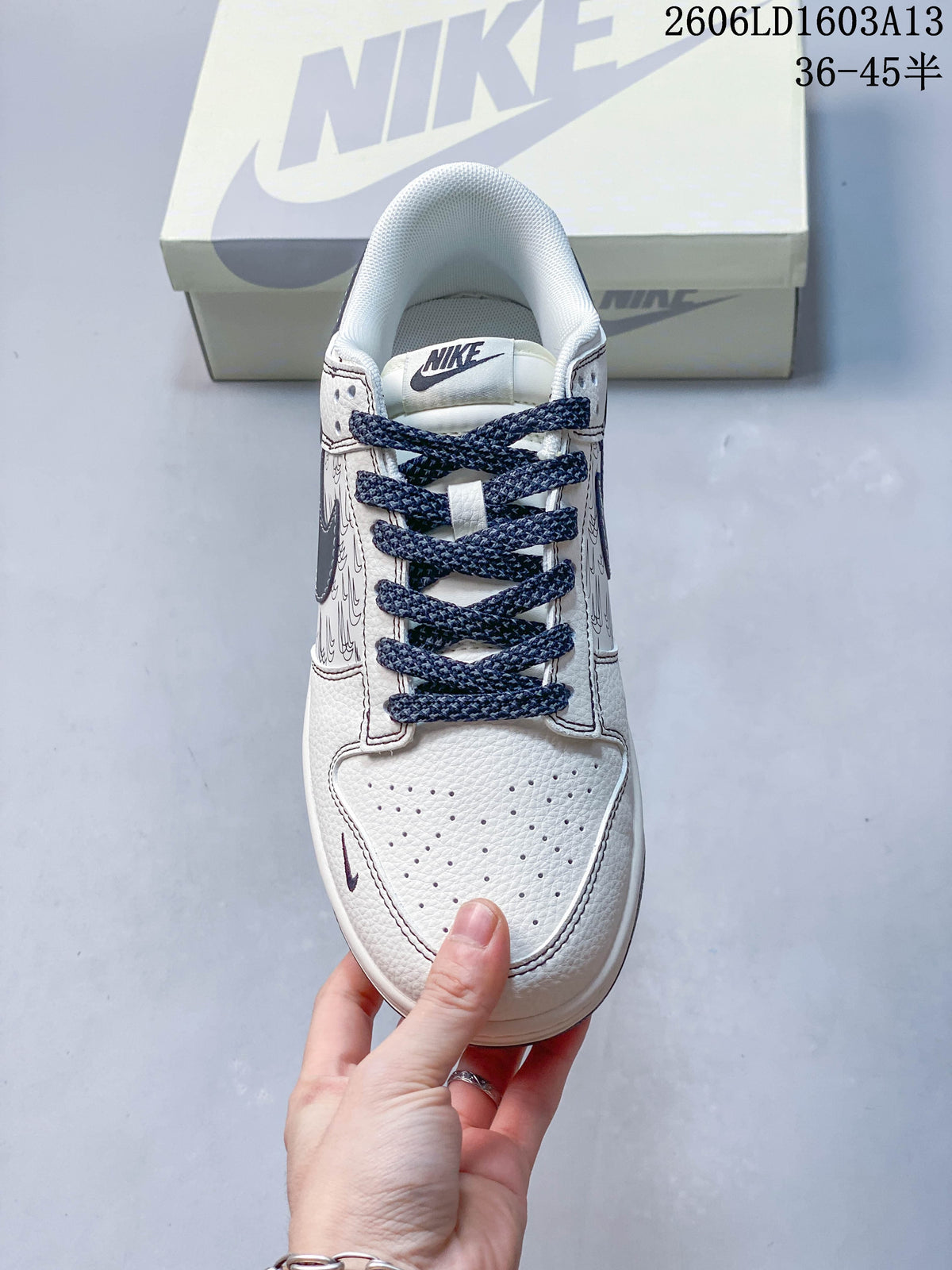 Top view showing the perforated toe, patterned panels, and navy laces.