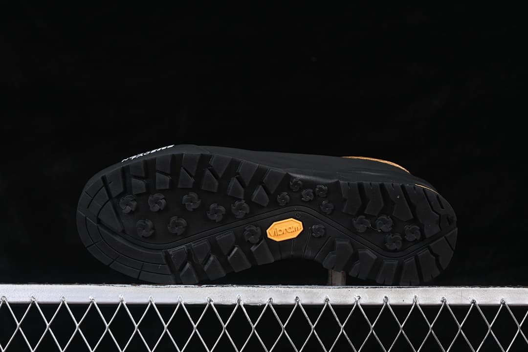 Underside view of the lugged outsole with Vibram mark