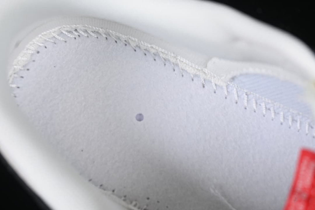 Close-up of the light-colored interior panel and stitching