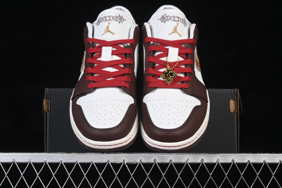 Front view of the pair showing perforated toe boxes, red laces, and lace charm