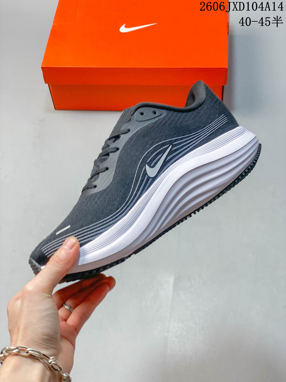 Side view of a gray Nike Journey Run 2 running shoe with a raised white midsole