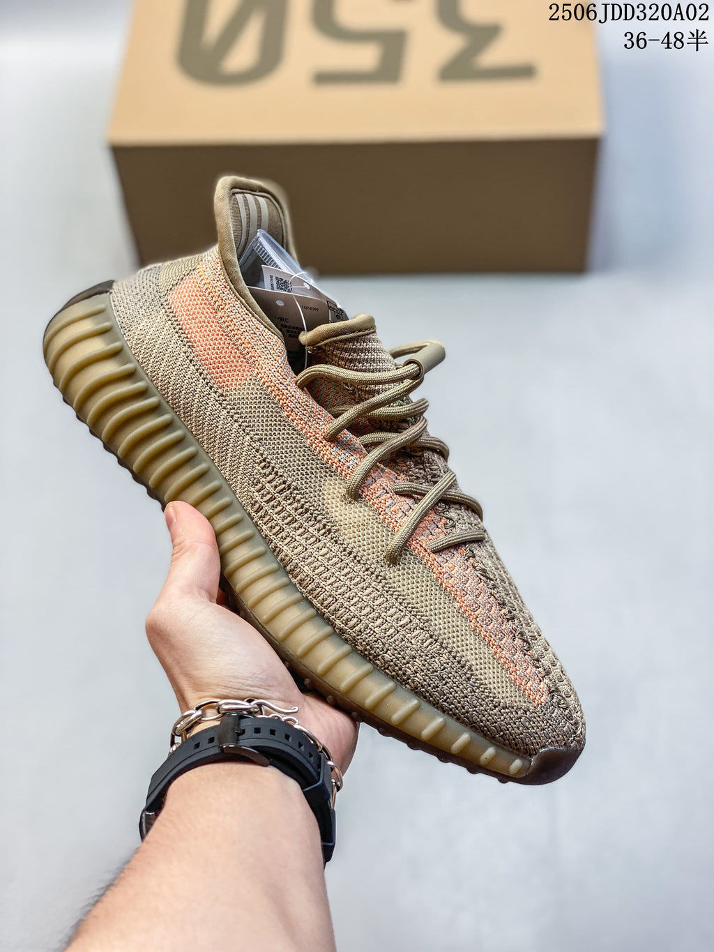 Tan and muted orange Adidas Yeezy-style knit-look sneaker