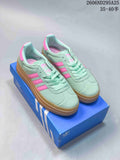Pair of mint-green Adidas Gazelle Bold W sneakers with pink stripes and a gum platform sole