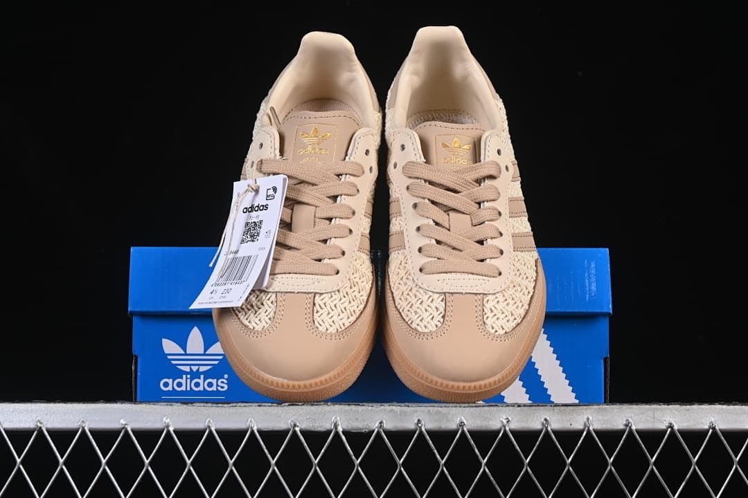 Front view of the pair displayed on a blue adidas shoe box