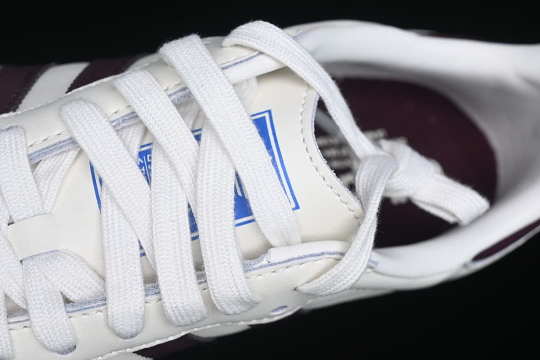 Close-up of white laces and tongue branding