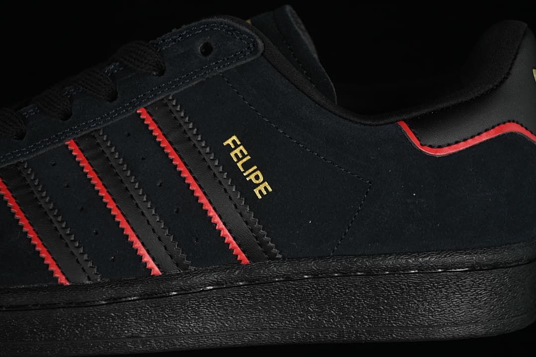 Close-up of the side stripes, gold lettering, and red accents