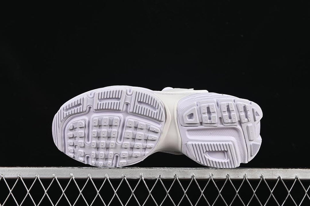 Underside view showing the patterned outsoles