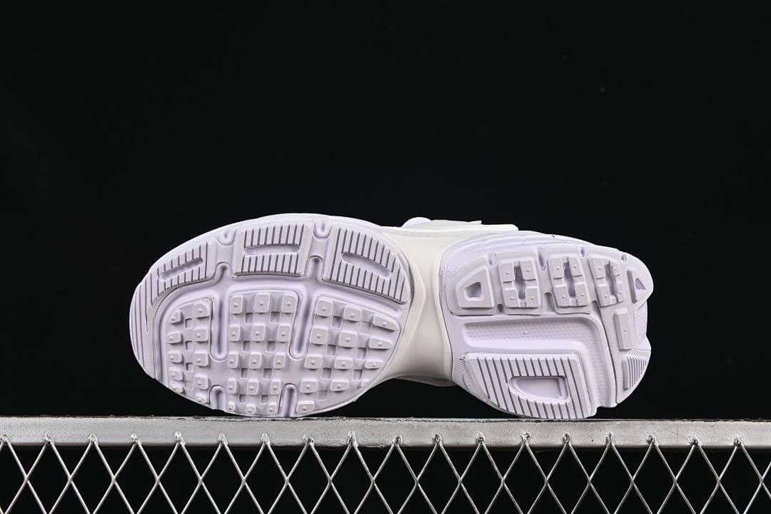 Underside view showing the patterned outsoles