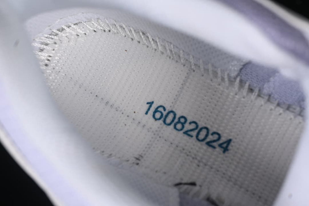 Close-up inside the shoe with a printed date-like code