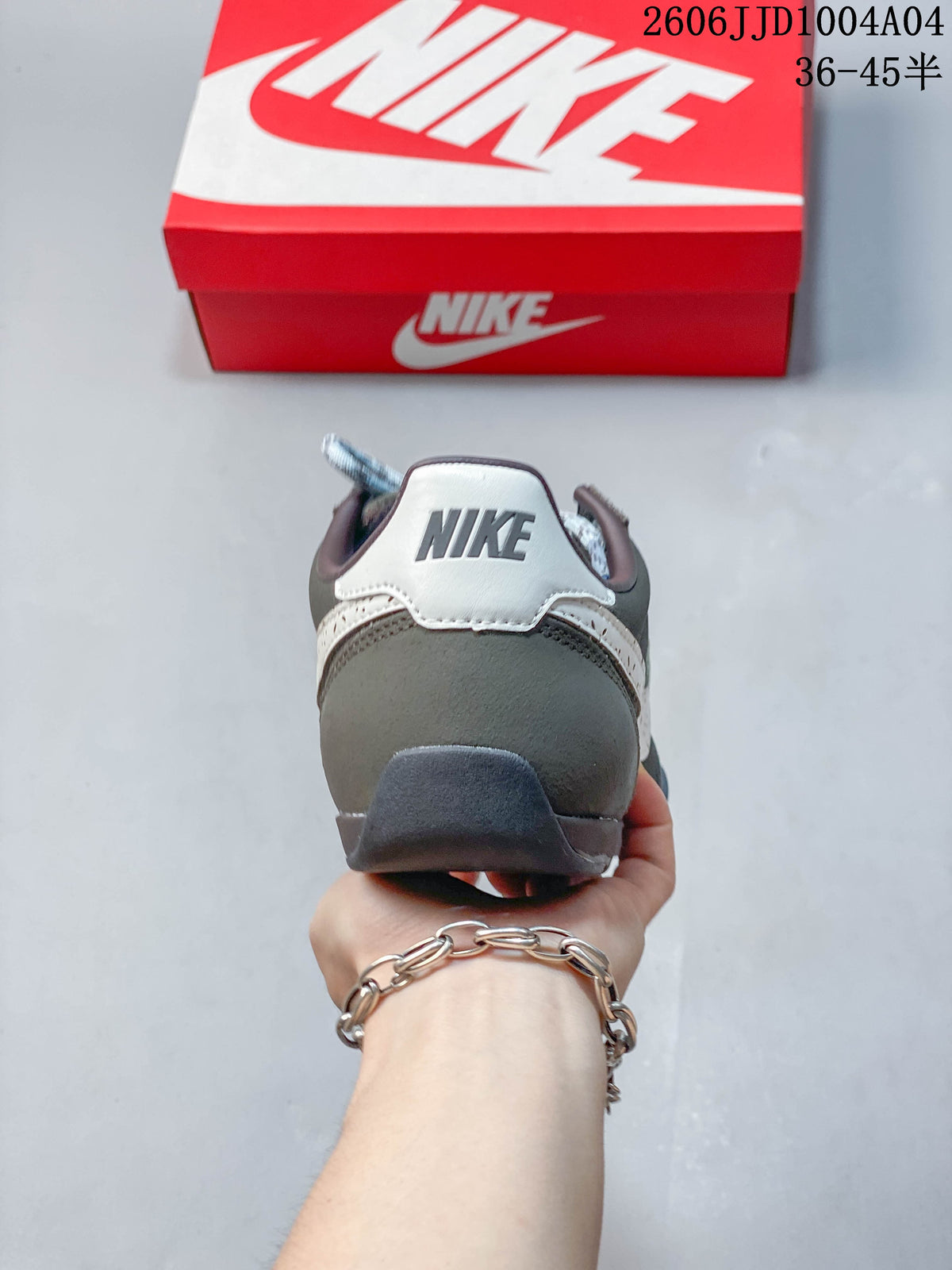 Rear view of a gray Nike Sprint Sister sneaker with a light-colored heel detail