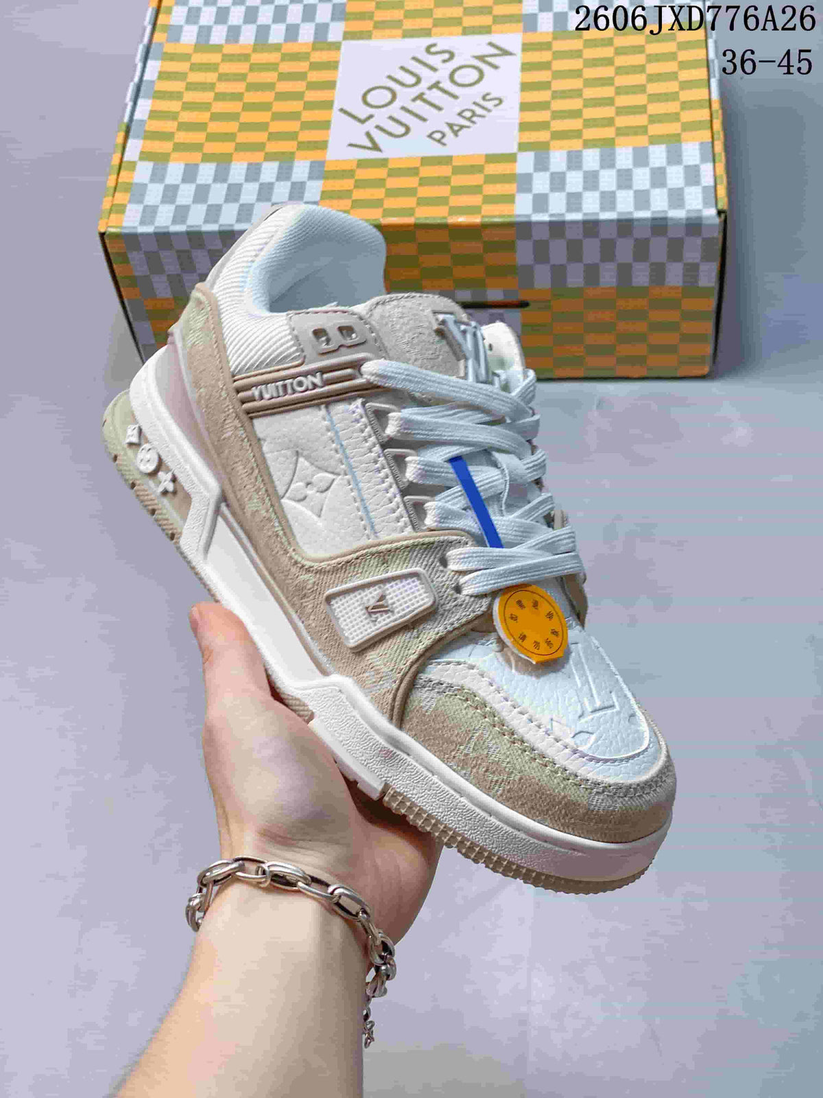 Close-up of a white and beige Louis Vuitton Trainer Low sneaker with textured panels