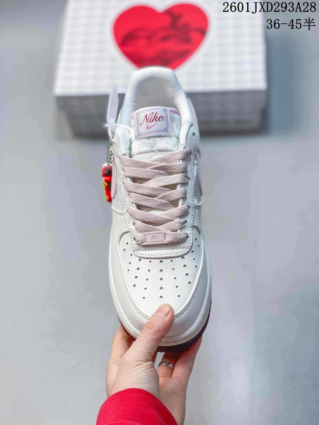 Front view showing the perforated toe and pale pink laces