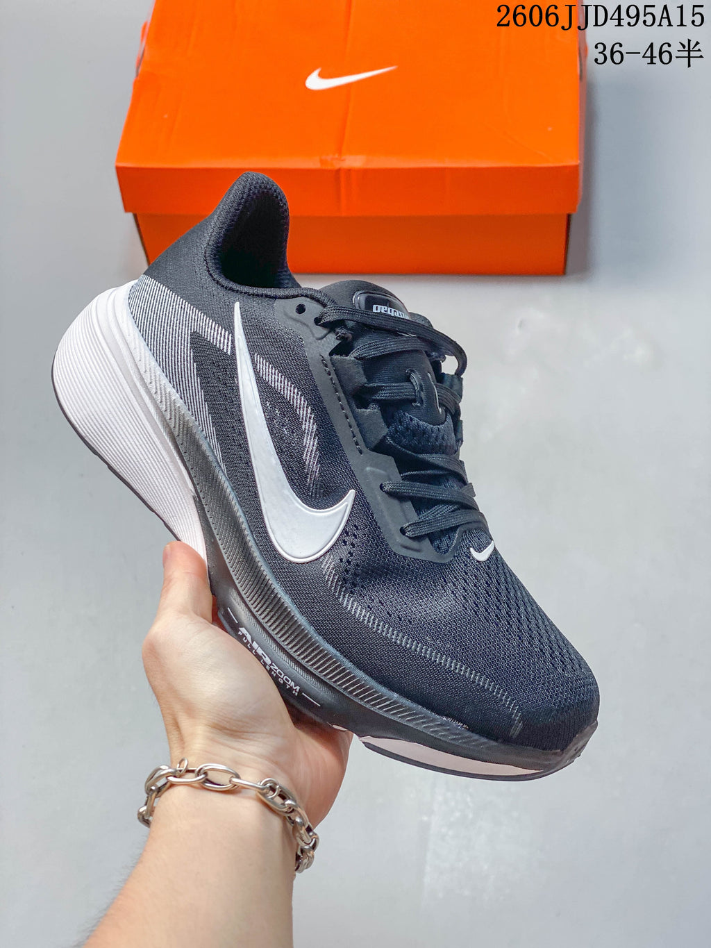 Dark navy Nike Air Zoom Pegasus 42 shoe with a white Swoosh and light gray sole
