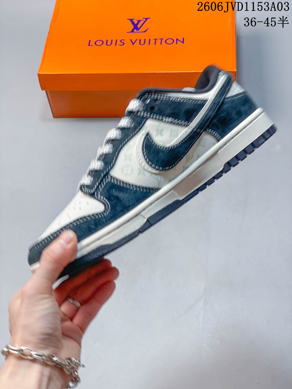 Side profile of the navy and white low-top sneaker