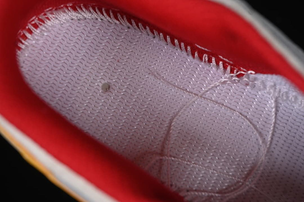 Close-up of the red-lined interior and stitching