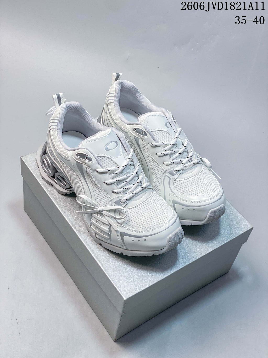 Pair of white and silver-toned mesh platform sneakers with bow details