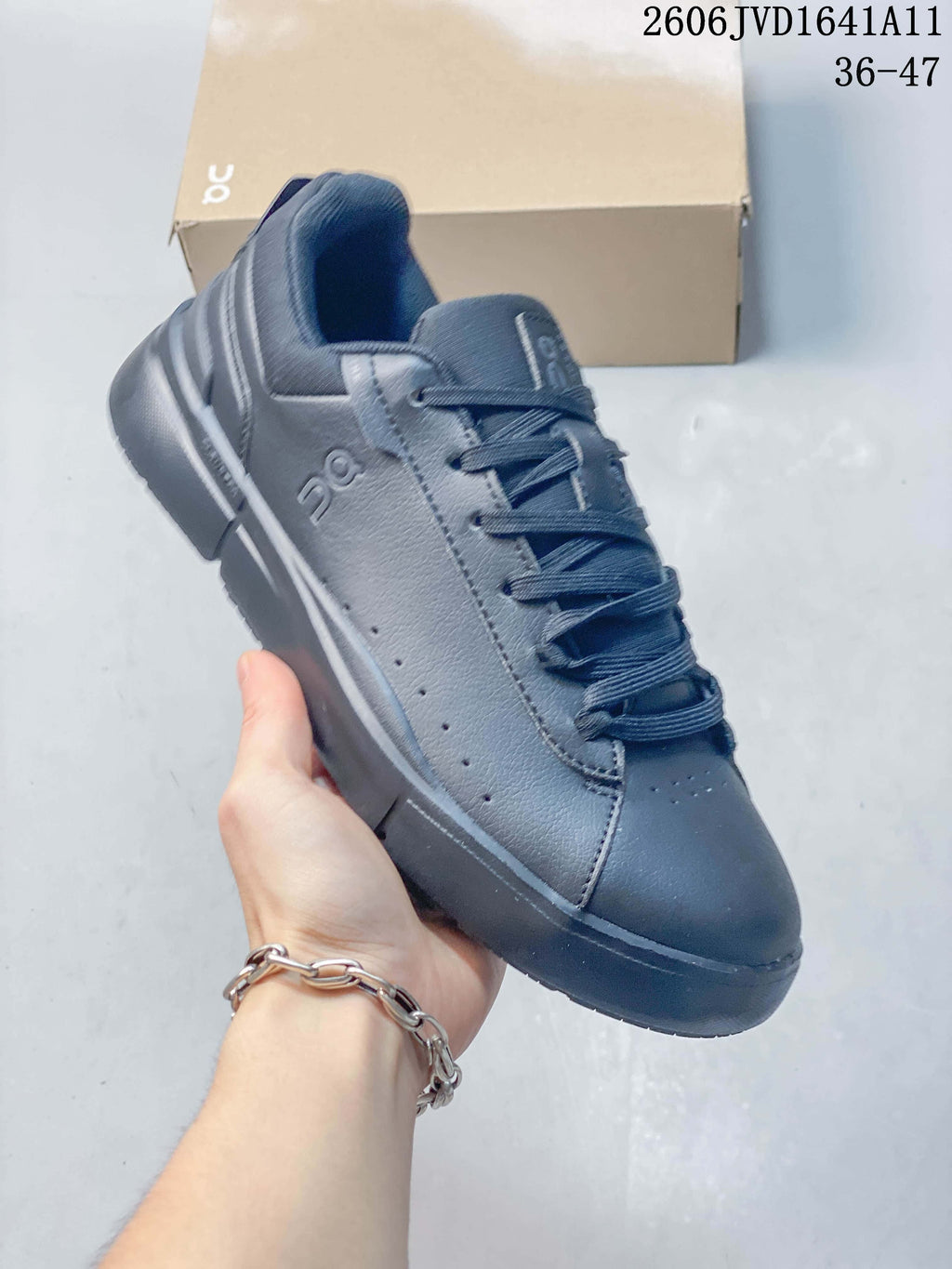 Angled side view of a slate-blue On low-top sneaker