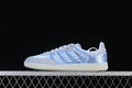 Side view of pale blue and gray adidas Samba OG HQ5160 sneakers