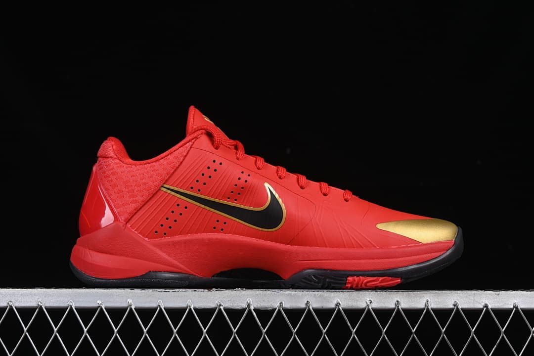 Side view of the shoe with black Swoosh and gold accents