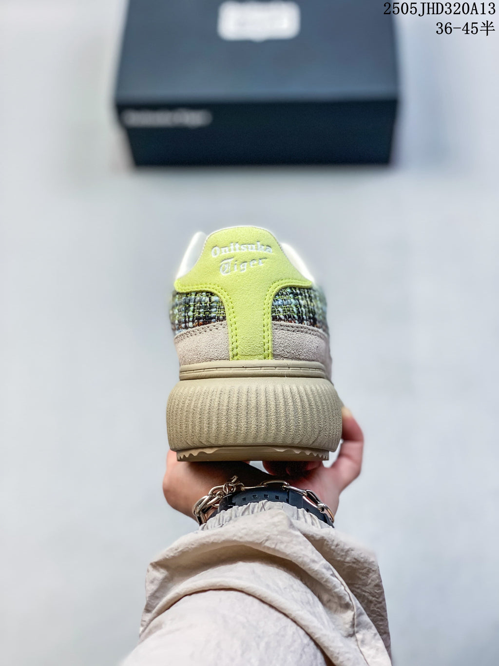 Rear view of a sneaker with a lime-green heel accent and multicolored panels