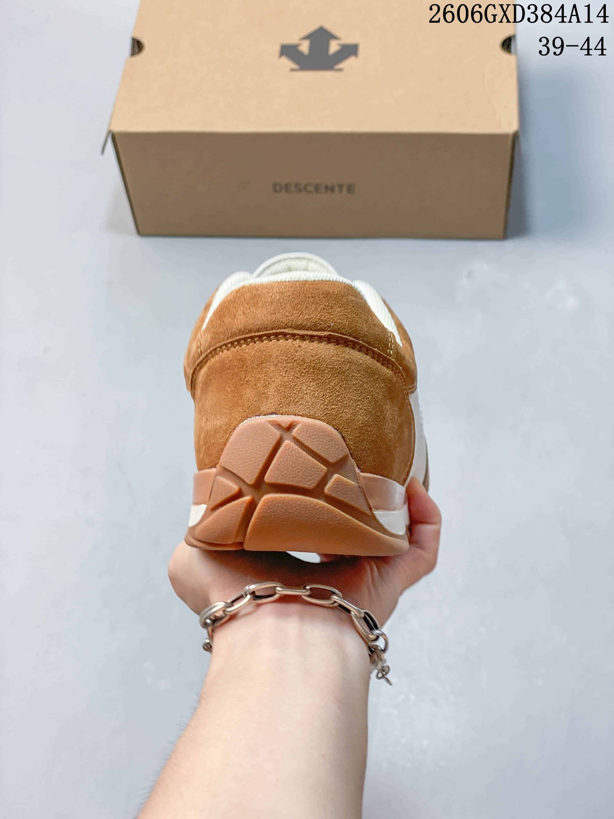 Rear view of a brown and white Descente sneaker
