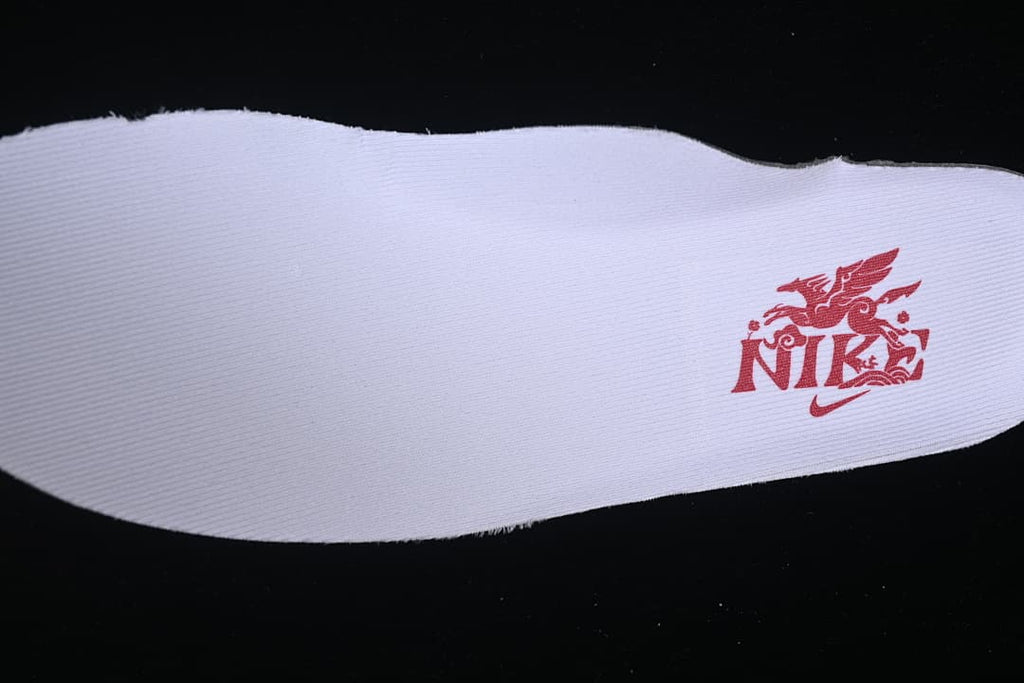 White insole with red graphic branding.