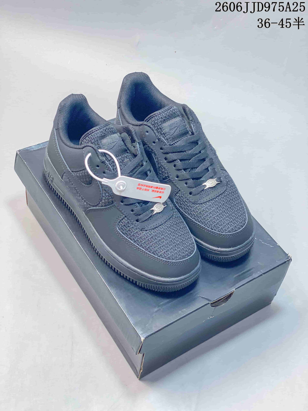 Dark gray low-top sneakers with woven-look panels
