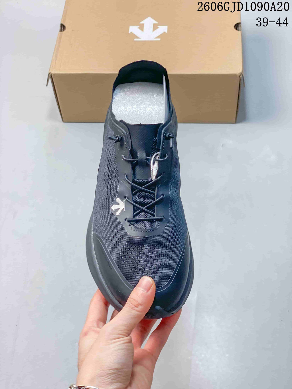 Front view of a dark gray Descente shoe with lace-style dial closure