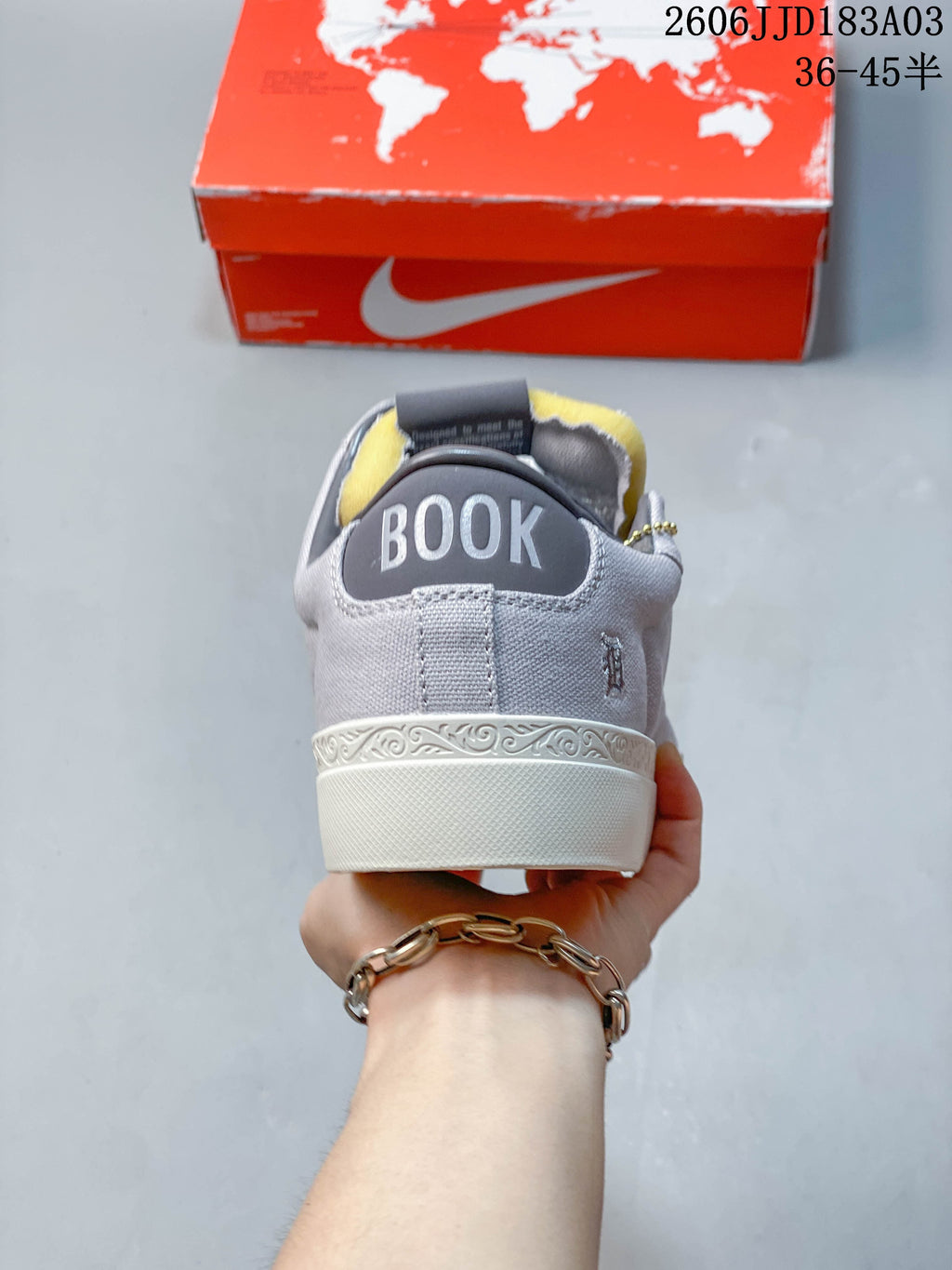 Rear view showing the BOOK heel detail on a gray Nike Devin Booker Blazer sneaker