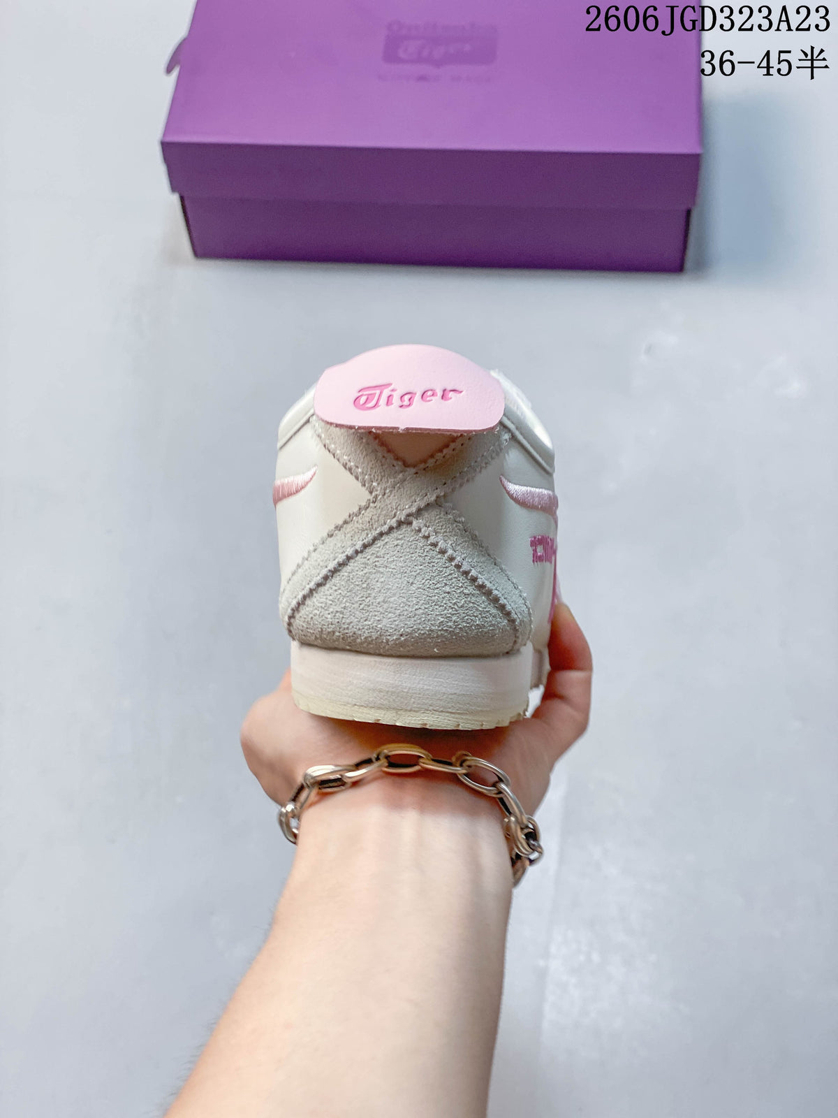 Rear view showing the heel construction and pink heel tab.