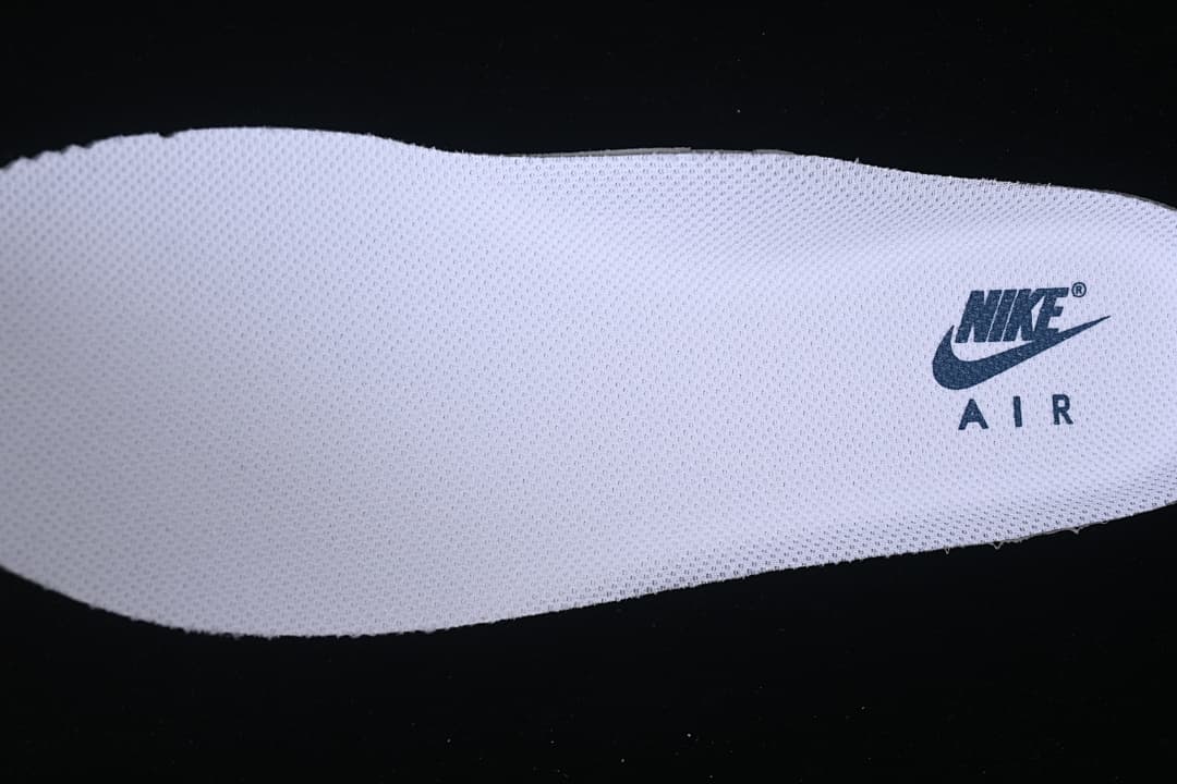 Close-up of the white shoe insole with Nike Air branding