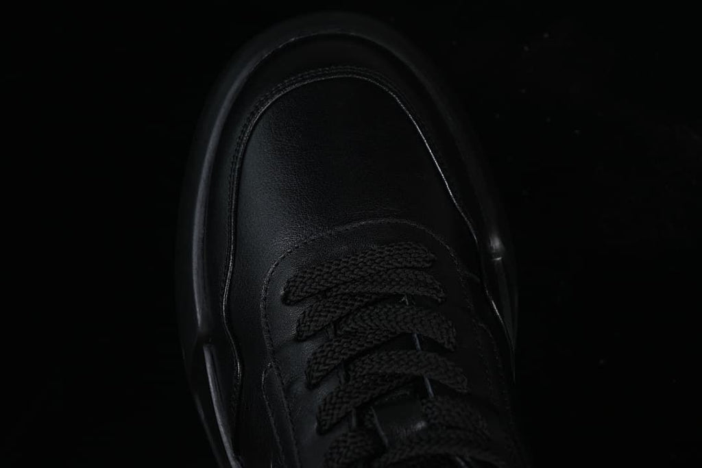 Top view of the sneaker toe and black laces