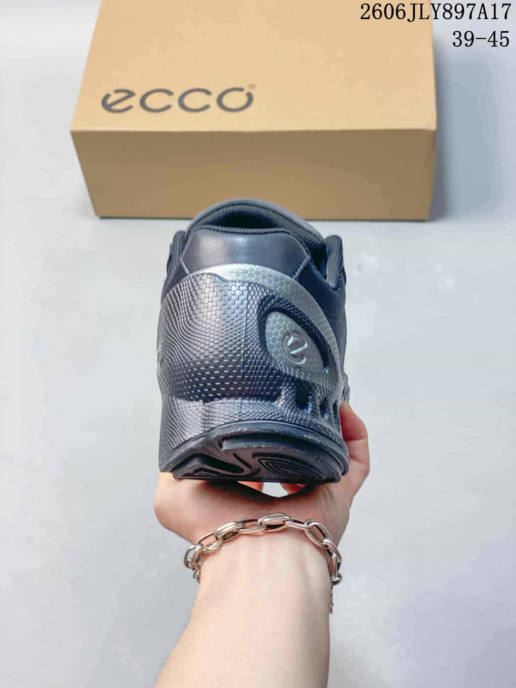 Rear view showing the heel and outsole of a dark navy ECCO sneaker; image overlay reads 39–45.