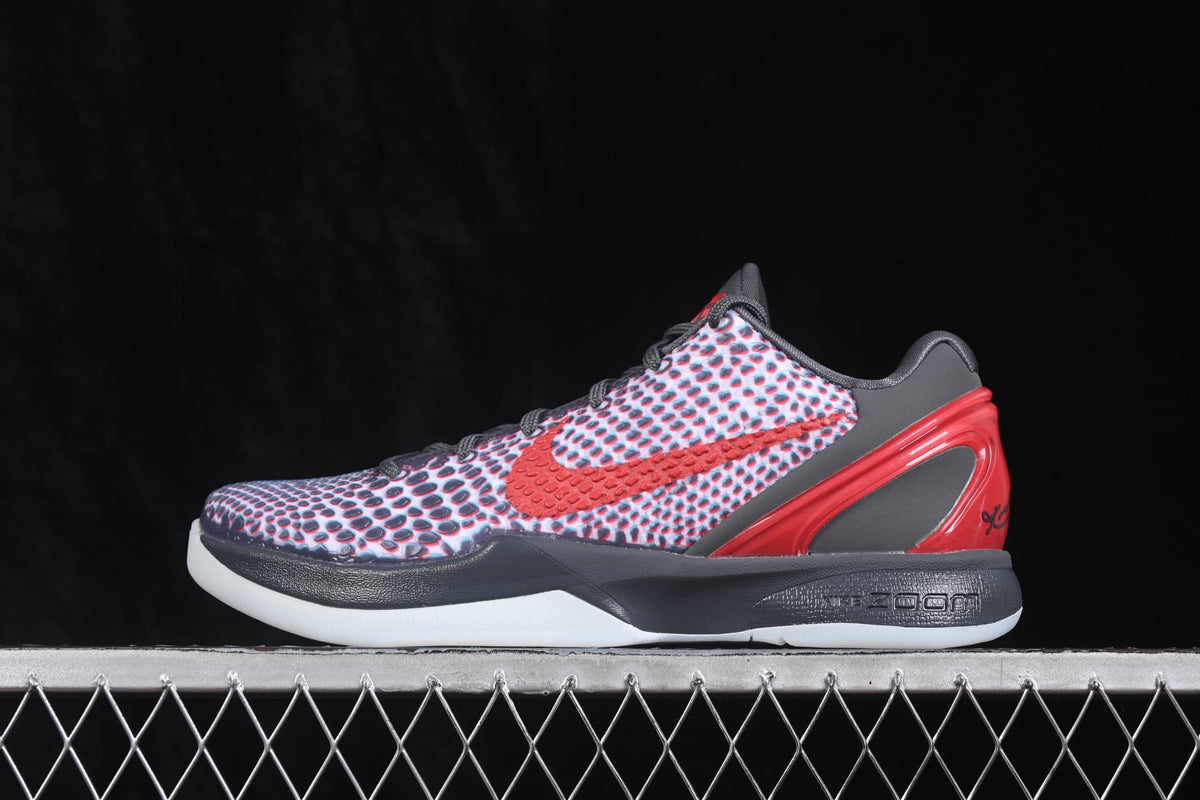 Side profile highlighting the red Swoosh, patterned upper, black midsole, red heel panel, and translucent outsole.