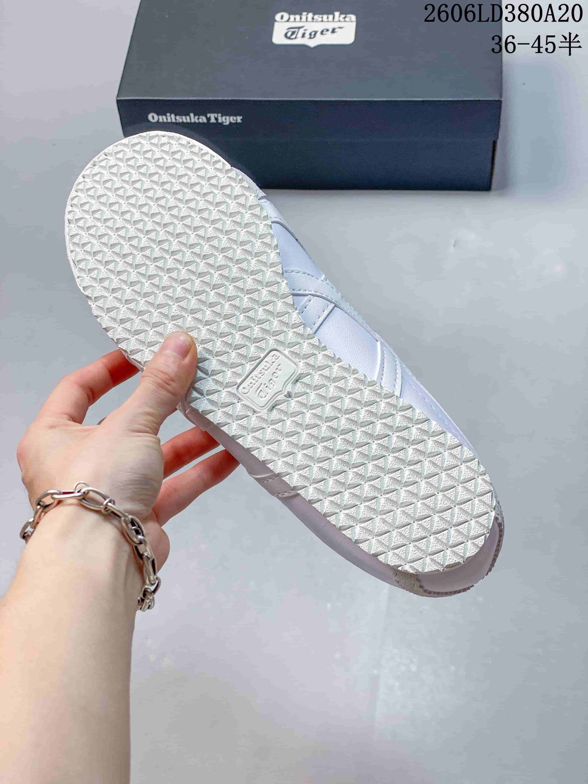 Textured outsole of a white Onitsuka Tiger sneaker
