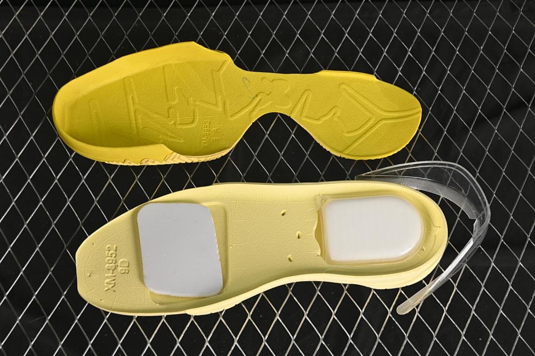 Yellow outsole and shoe insert shown separately