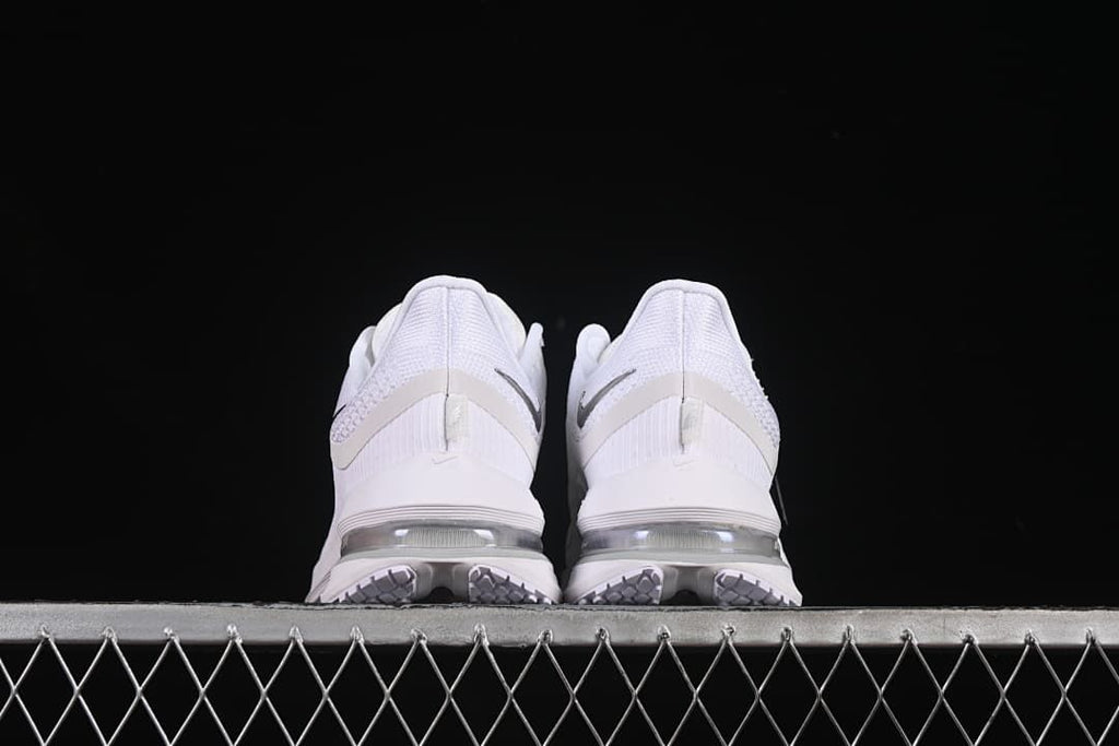 Rear view of both shoes showing heel details and cushioning units.