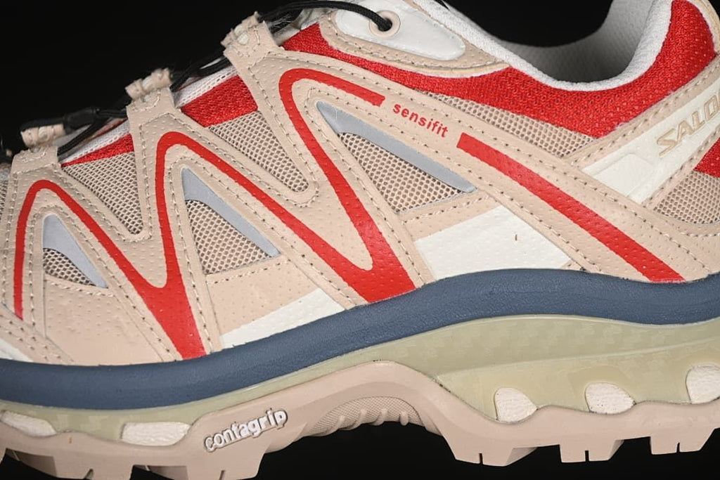 Close-up of the side overlays, mesh panels, quick-lace system, and midsole