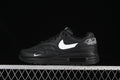 Side view of a black Nike Air Max 1 sneaker with a white Swoosh, heel embroidery and visible Air unit