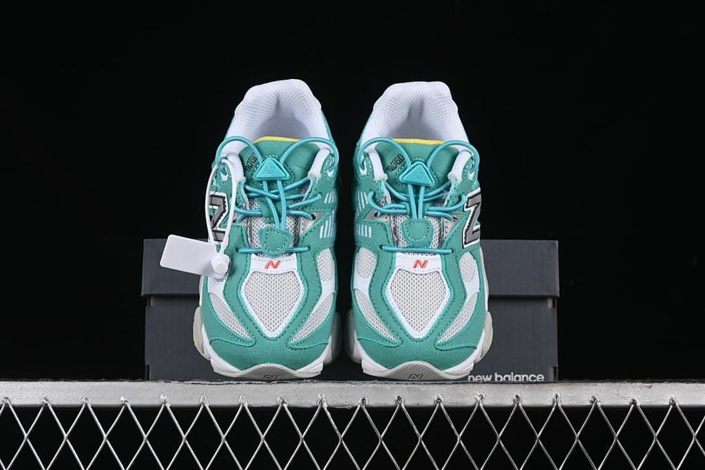 Front view of the pair showing teal overlays and white mesh panels