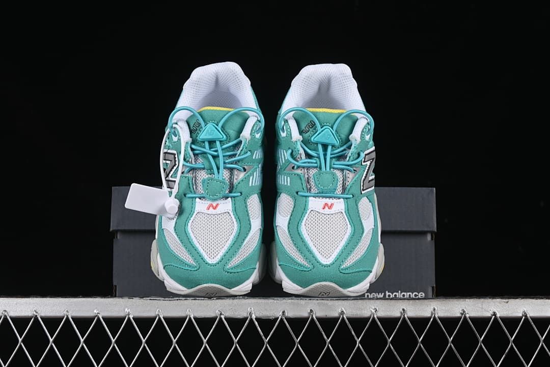 Front view of the pair showing teal overlays and white mesh panels
