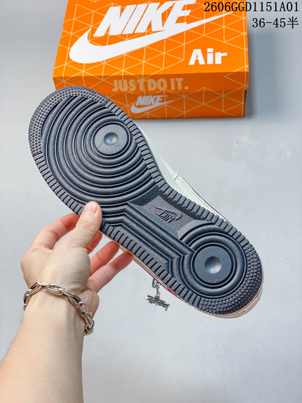 Close-up of the dark patterned outsole on the Nike Air Force 1 '07 LV8 sneaker