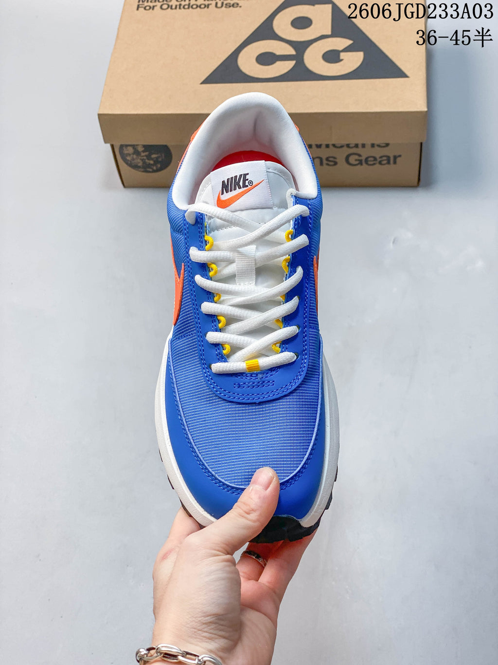 Top view of the sneaker showing the laces and layered blue upper