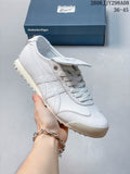 White Onitsuka Tiger Mexico 66 Golf low-top sneaker with a lugged outsole beside a branded box.