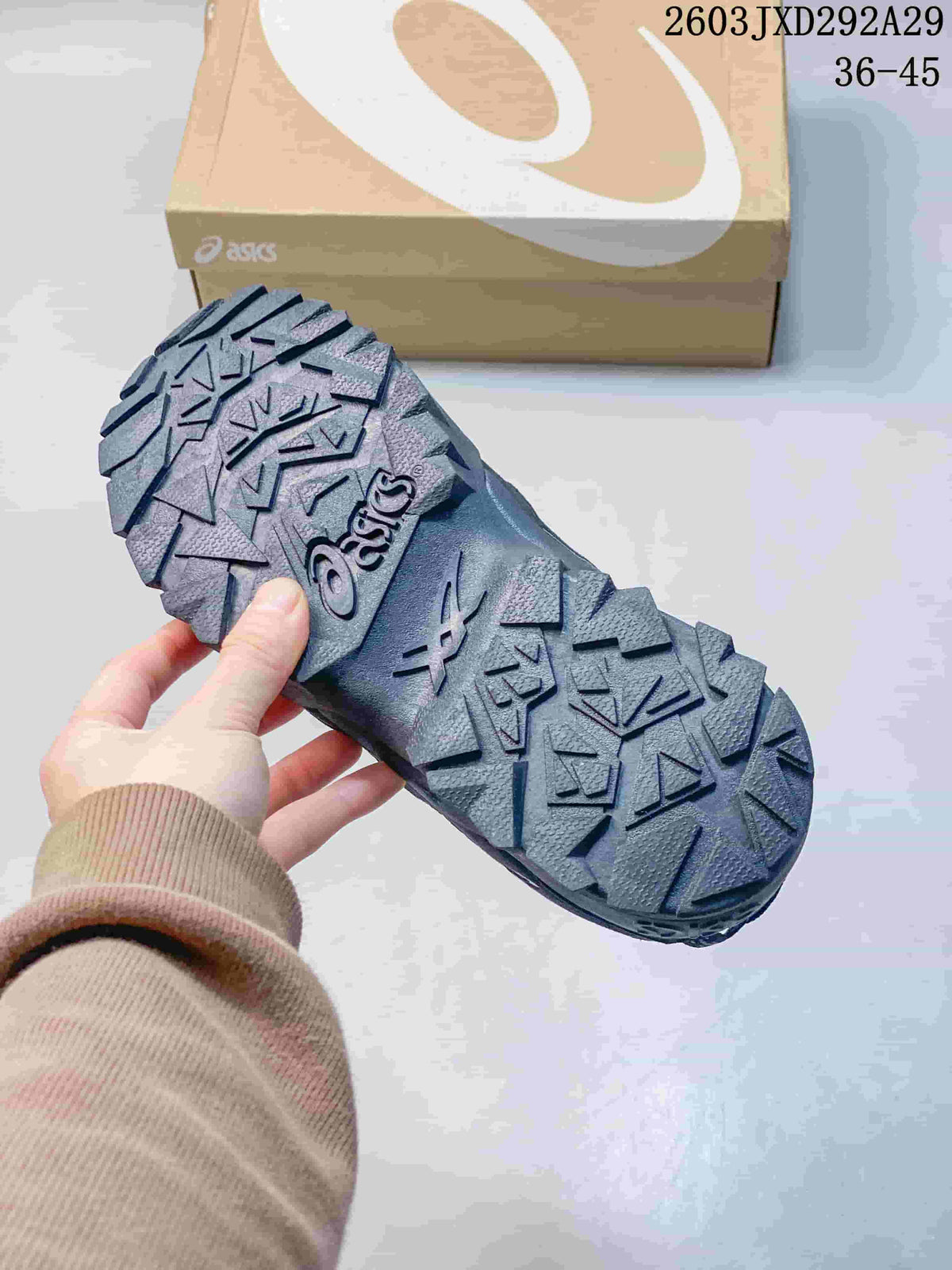 Close-up of the rugged, deeply treaded outsole