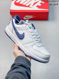White low-top Nike sneaker with blue Swoosh accents held above a red Nike shoe box; overlay text shows style 2604JGD129A17 and size range 36-45.