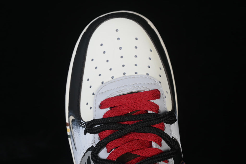 Top-down close-up of perforated toe and red and black laces