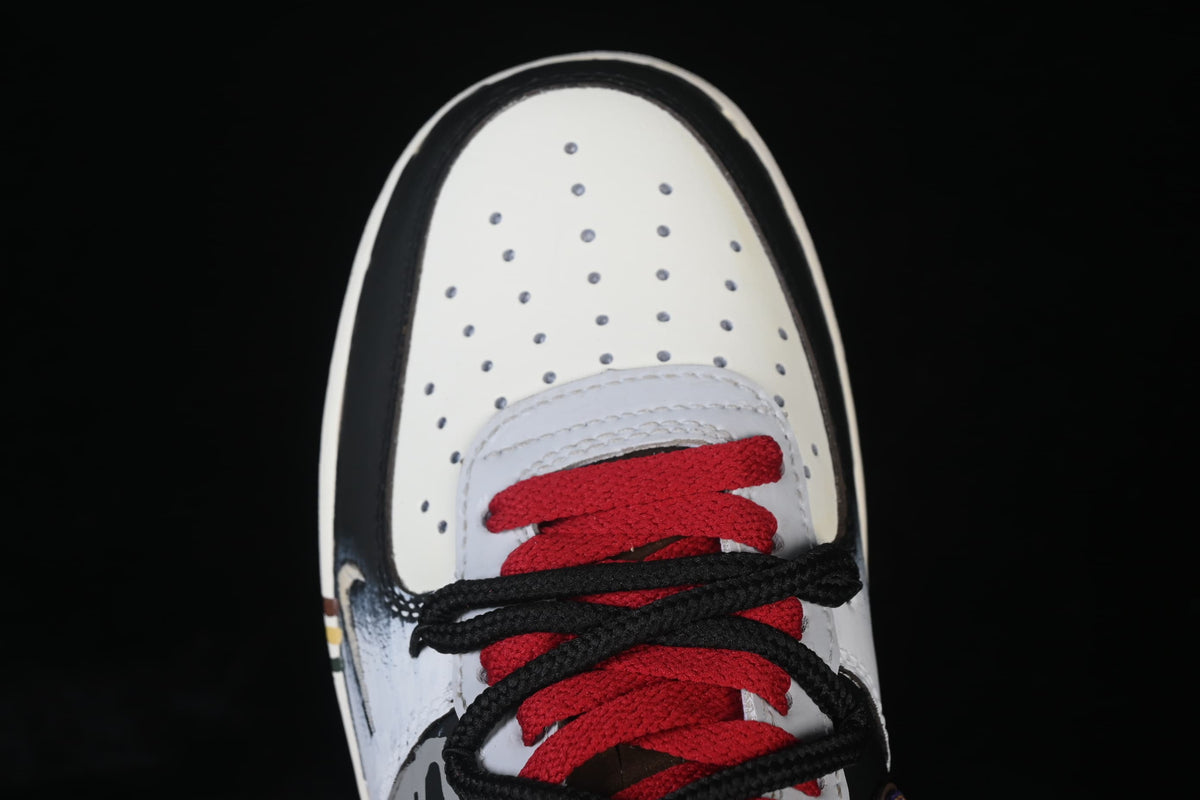 Top-down close-up of perforated toe and red and black laces