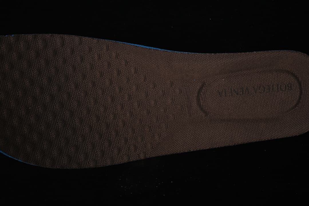 Close-up of the textured brown shoe insole.