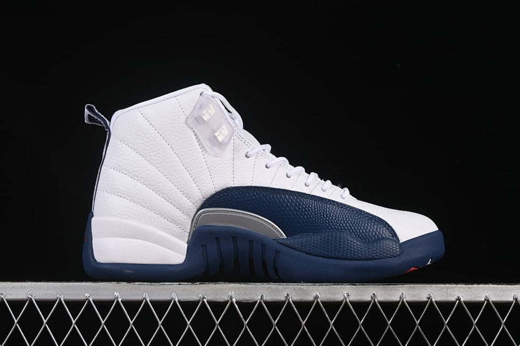 Outer side view showing the white upper and navy overlay